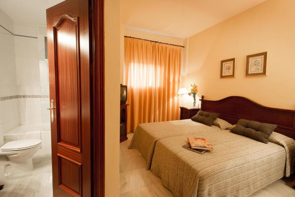 Hotel Gran Avenida Coria del Río Pokoj fotografie